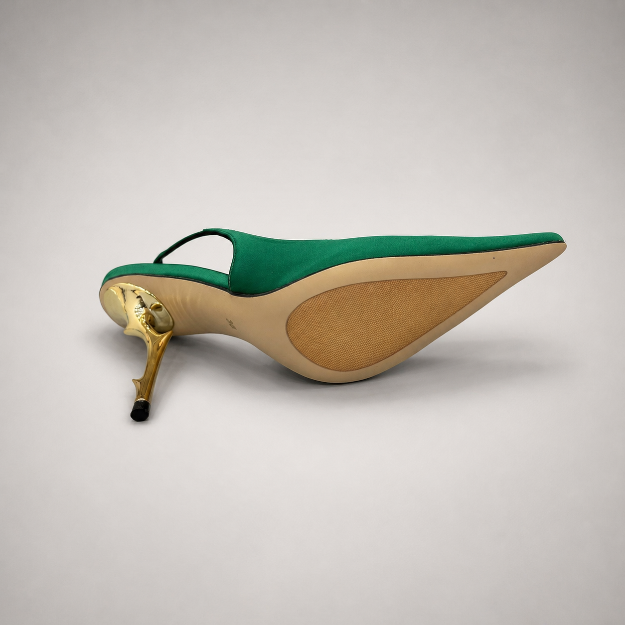 Green slingback pump outsole view showing the cow leather outsole