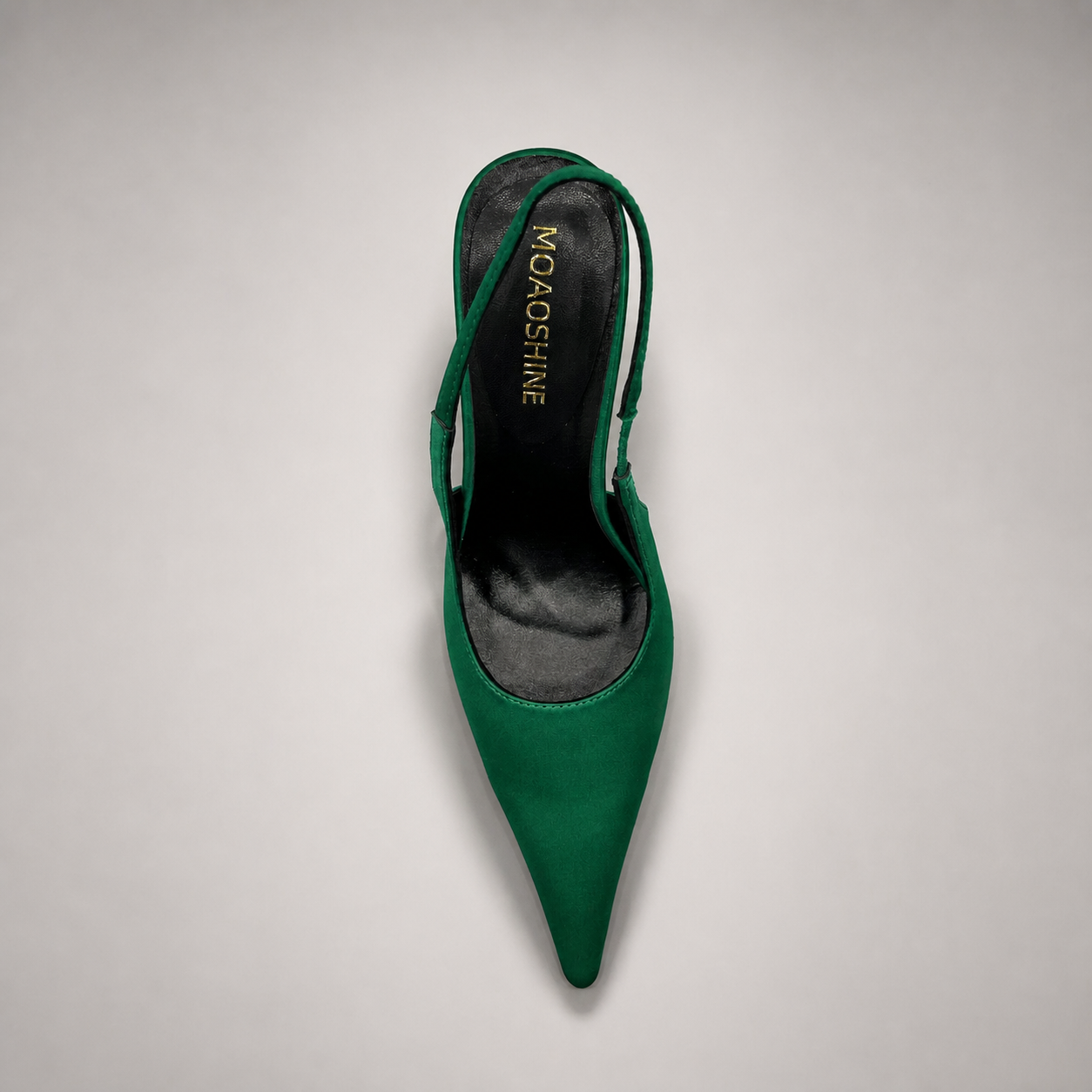 Green slingback pump top view showing a pointed toe and sculpted heel
