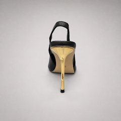 Black slingback pump rear view showing a pointed toe and sculpted heel