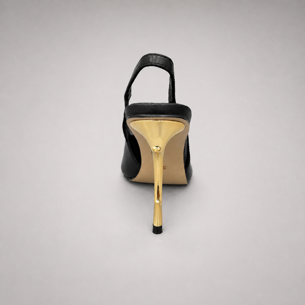 Black slingback pump rear view showing a pointed toe and sculpted heel