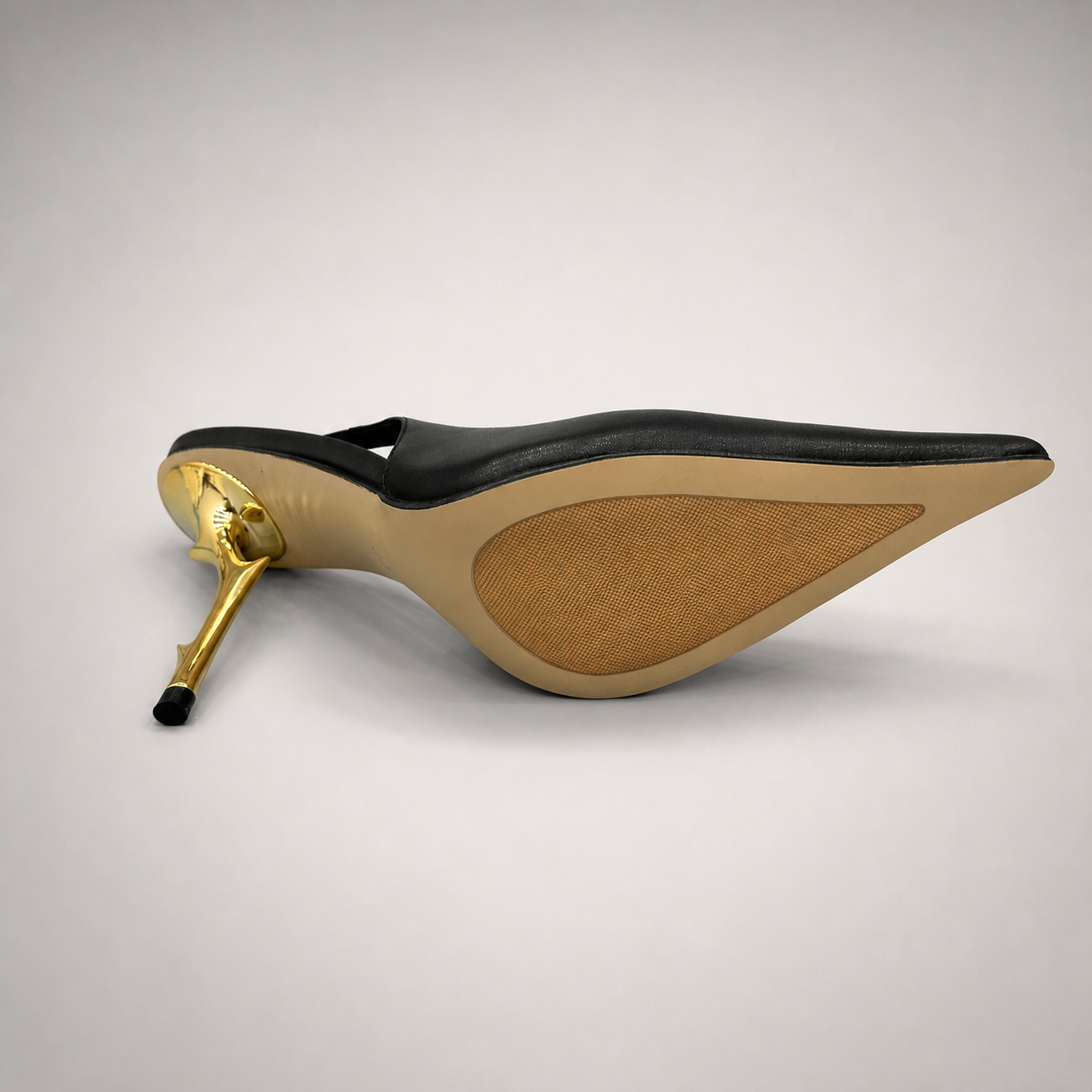 Black slingback pump outsole view showing the cow leather outsole