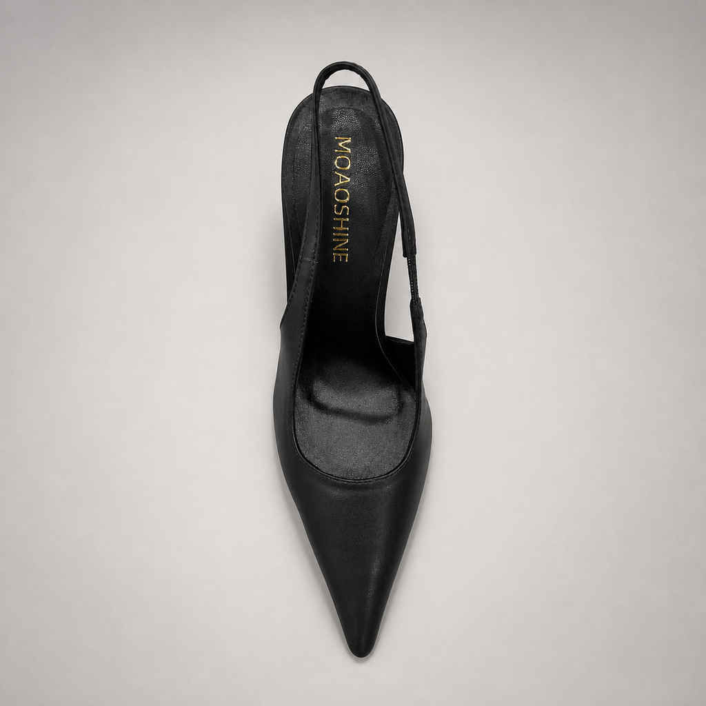 Black slingback pump top view showing a pointed toe and sculpted heel