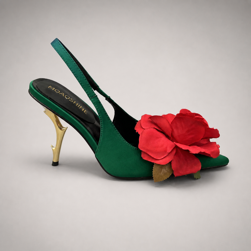Green slingback pump side profile showing a pointed toe and floral appliqué