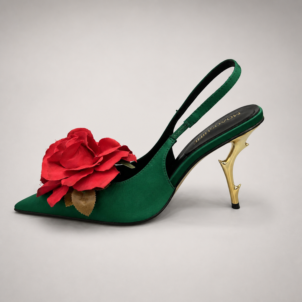 Green slingback pump opposite side profile showing a pointed toe and floral appliqué
