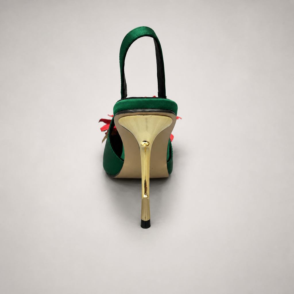 Green slingback pump top view showing a pointed toe and floral appliqué
