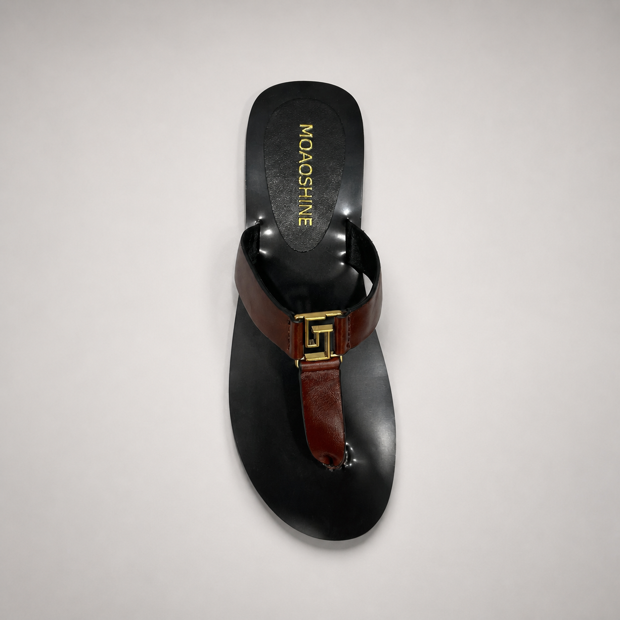 Brown flat sandal outsole view showing the cow leather outsole