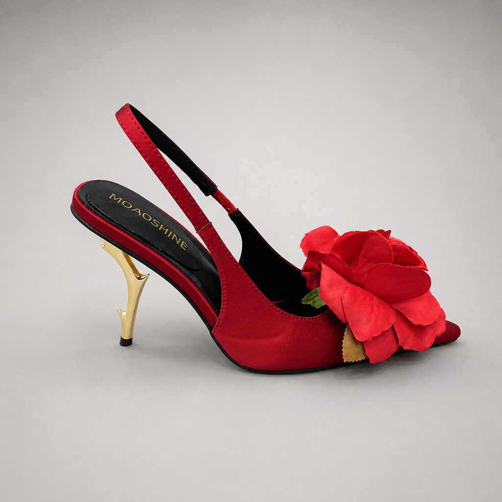 Red slingback pump side profile showing a pointed toe and floral appliqué