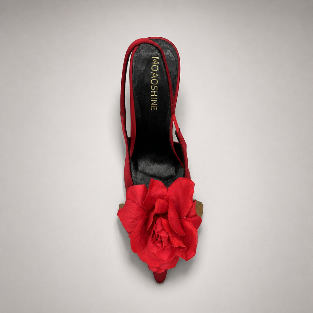 Red slingback pump rear view showing a pointed toe and floral appliqué