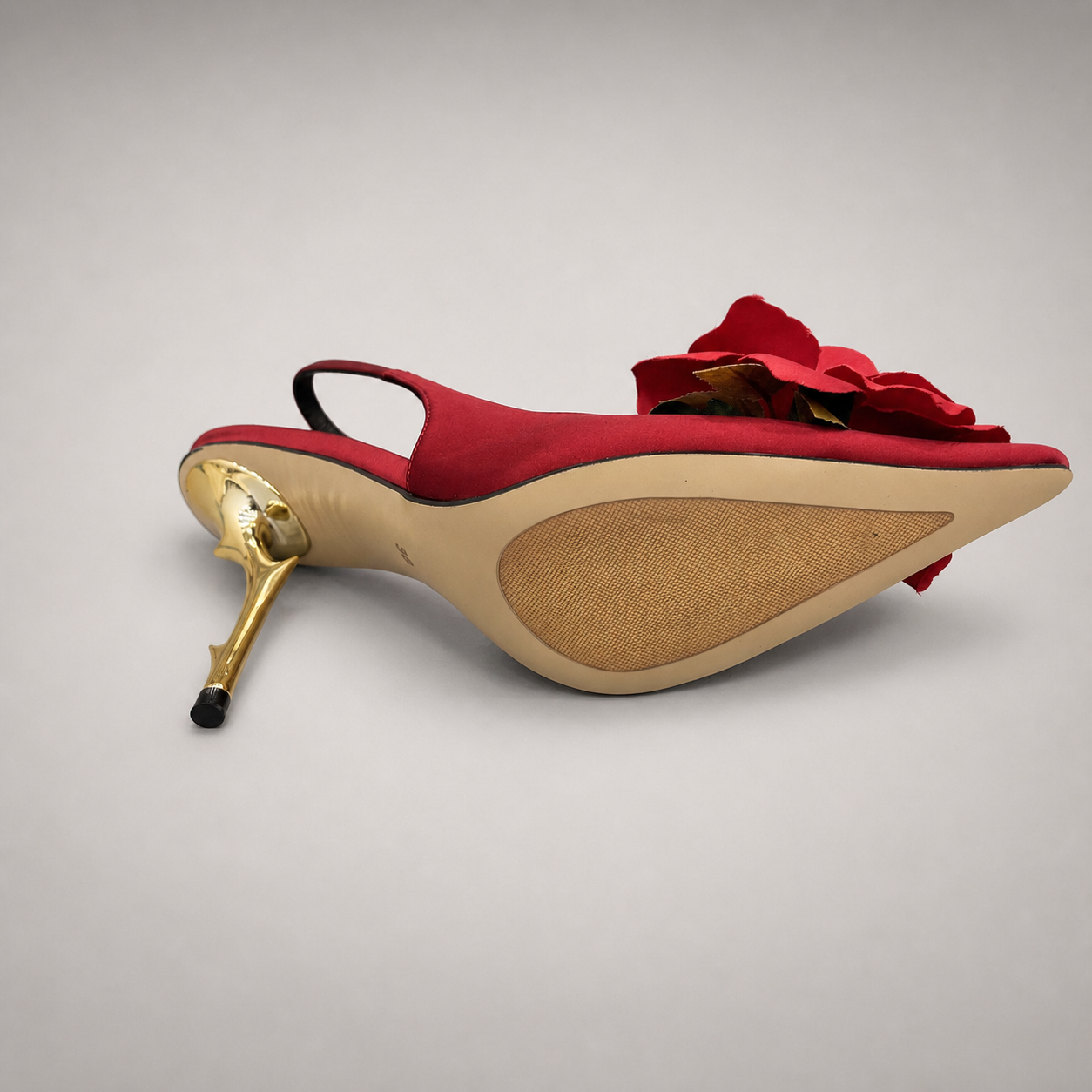 Red slingback pump outsole view showing the cow leather outsole