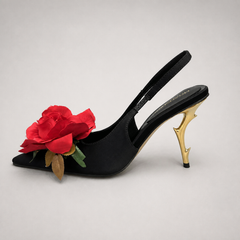 Black slingback pump opposite side profile showing a pointed toe and floral appliqu¨¦