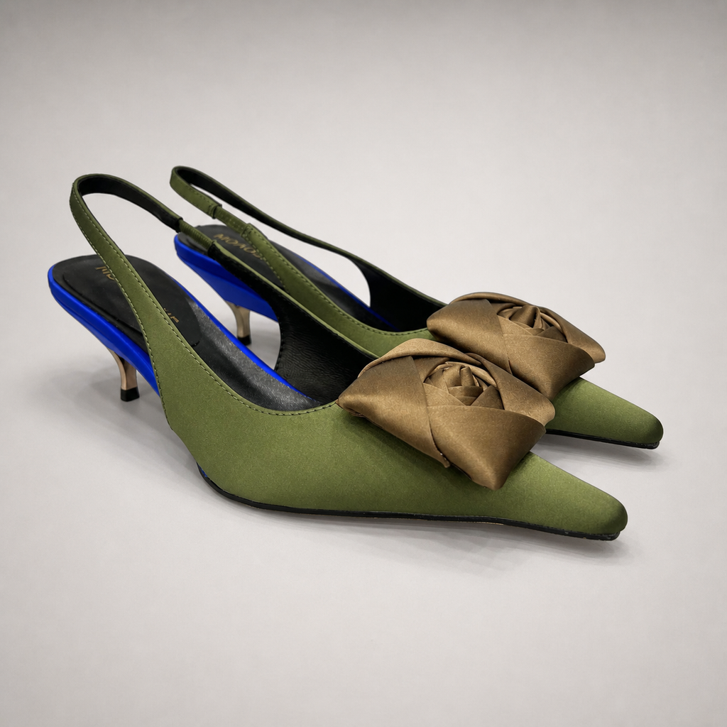 Olive slingback pump pair three-quarter view showing a pointed toe and bow detail