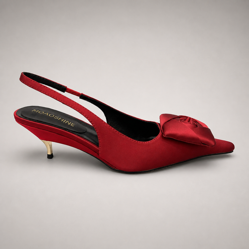 Red slingback pump side profile showing a pointed toe and bow detail