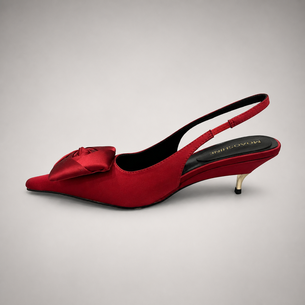 Red slingback pump opposite side profile showing a pointed toe and bow detail