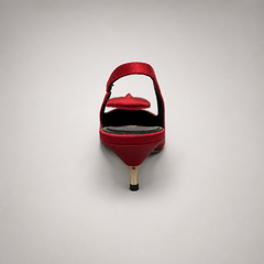 Red slingback pump rear view showing a pointed toe and bow detail
