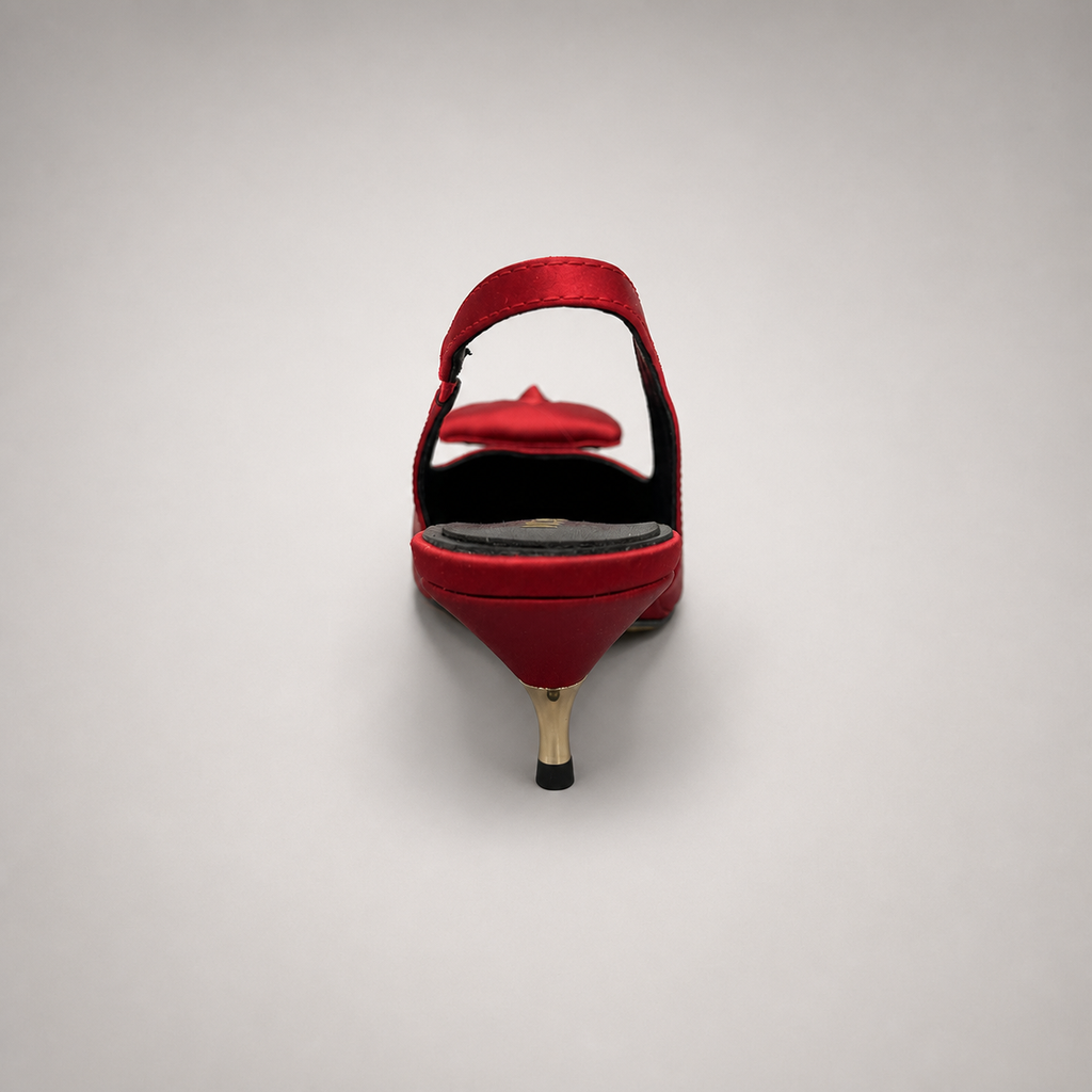Red slingback pump rear view showing a pointed toe and bow detail