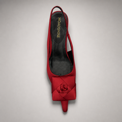 Red slingback pump top view showing a pointed toe and bow detail