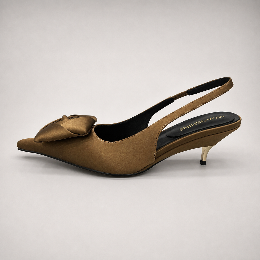Brown slingback pump side profile showing a pointed toe and bow detail