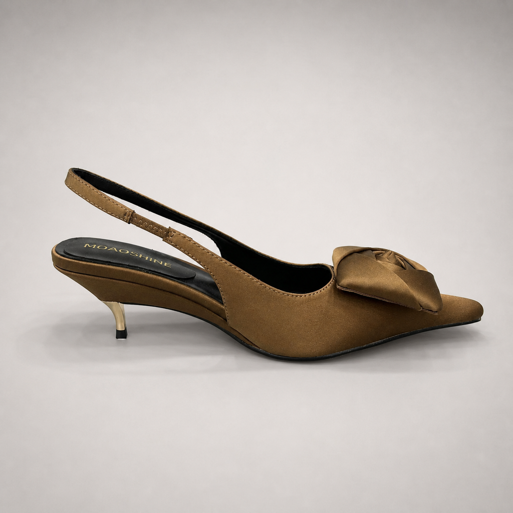 Brown slingback pump opposite side profile showing a pointed toe and bow detail