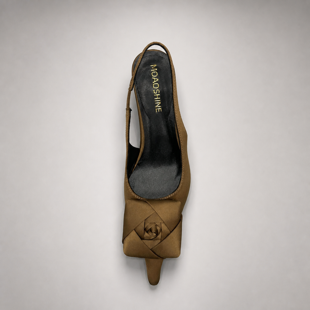 Brown slingback pump outsole view showing the cow leather outsole