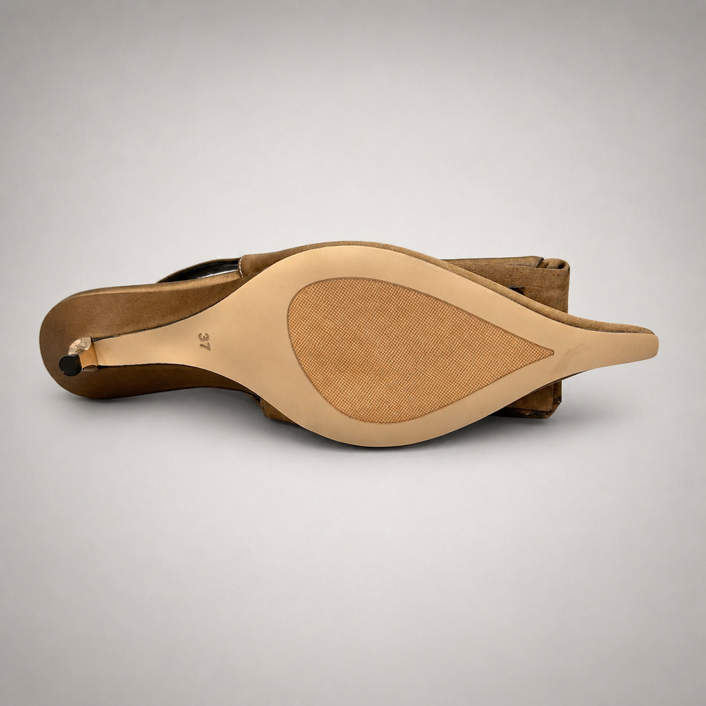 Brown slingback pump top view showing a pointed toe and bow detail