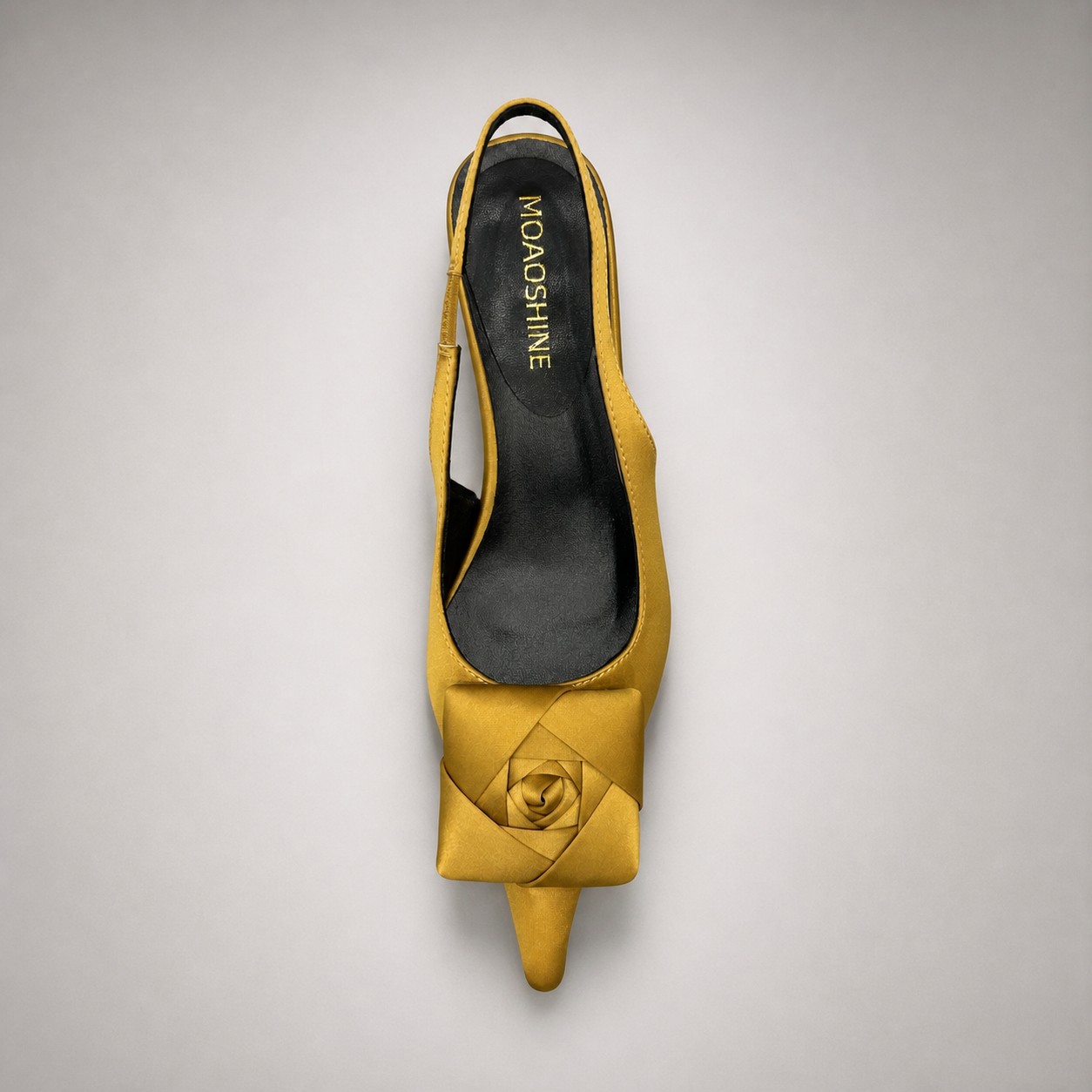 Gold slingback pump outsole view showing the cow leather outsole