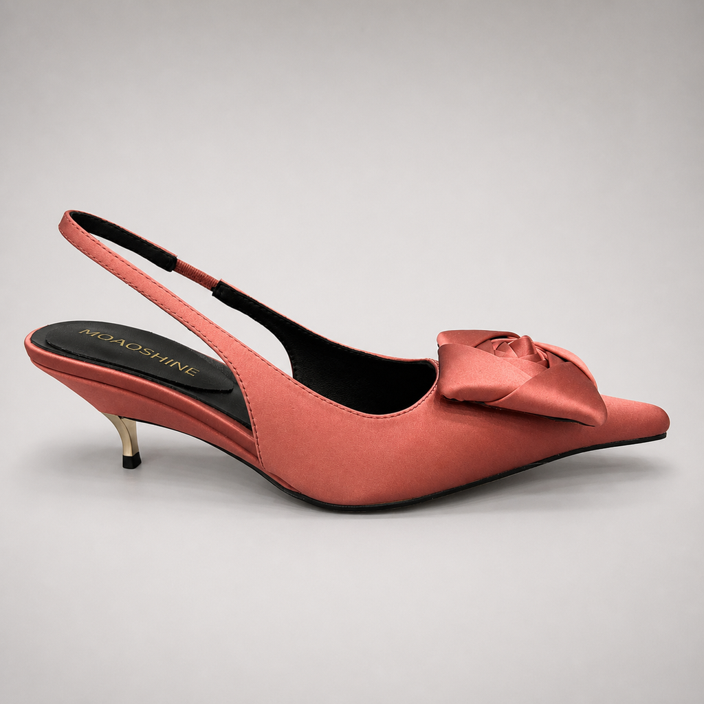 Pink slingback pump side profile showing a pointed toe and bow detail