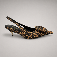 Brown slingback pump side profile showing a leopard-print upper and bow detail