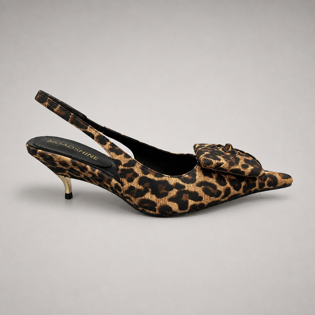 Brown slingback pump side profile showing a leopard-print upper and bow detail