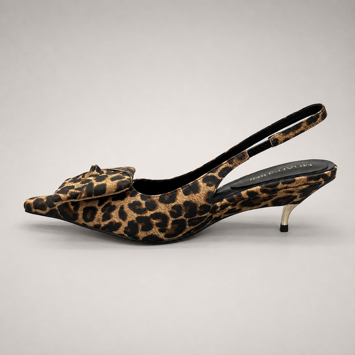 Brown slingback pump opposite side profile showing a leopard-print upper and bow detail