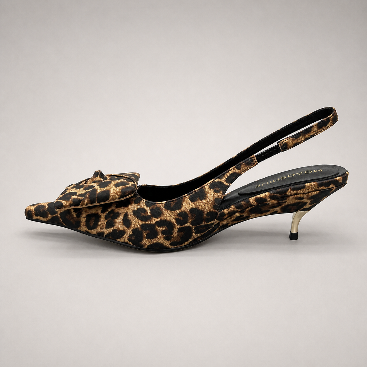 Brown slingback pump opposite side profile showing a leopard-print upper and bow detail