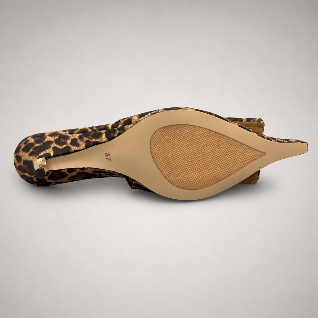 Brown slingback pump top view showing a leopard-print upper and bow detail