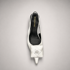 White slingback pump rear view showing a pointed toe and bow detail