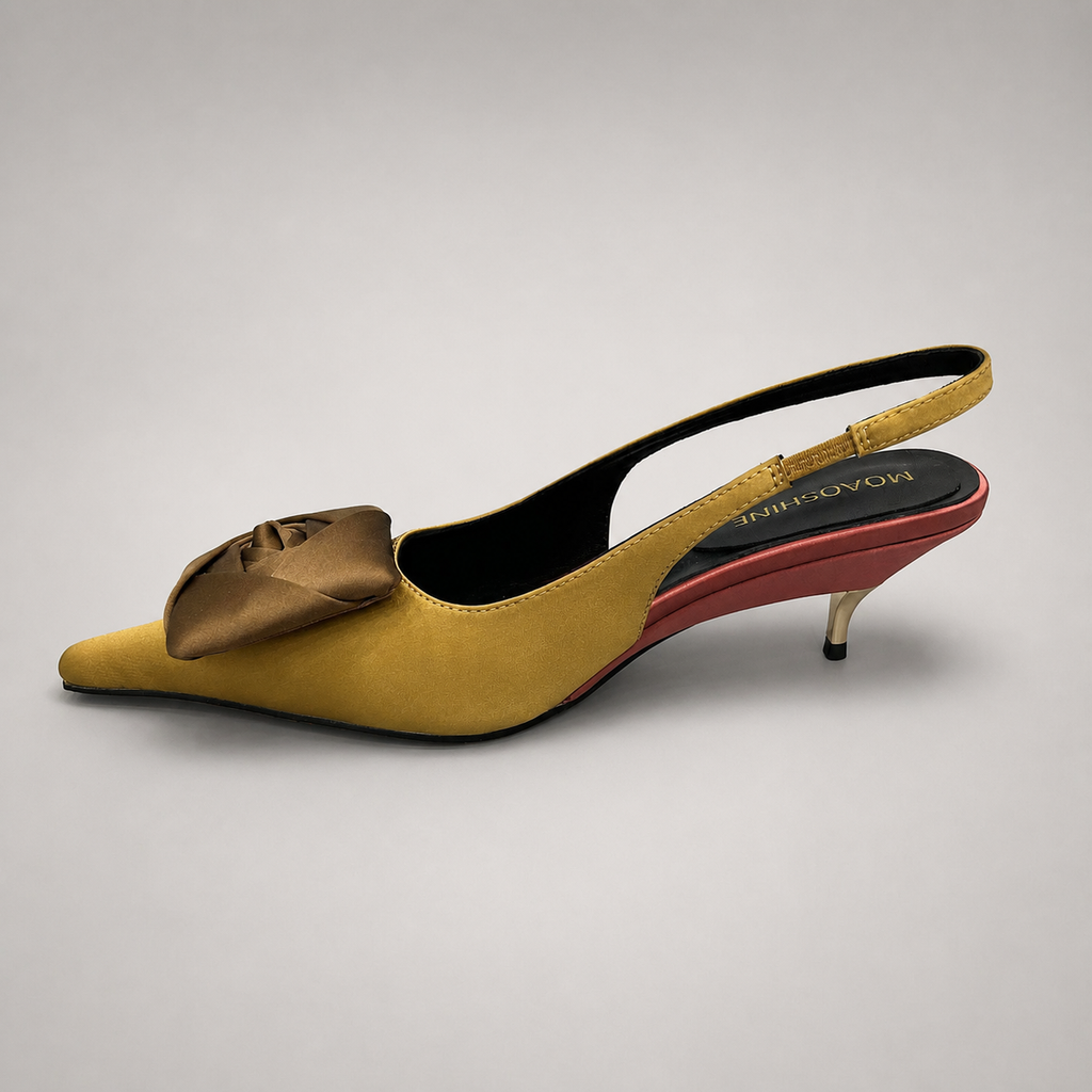 Tan slingback pump opposite side profile showing a pointed toe and bow detail