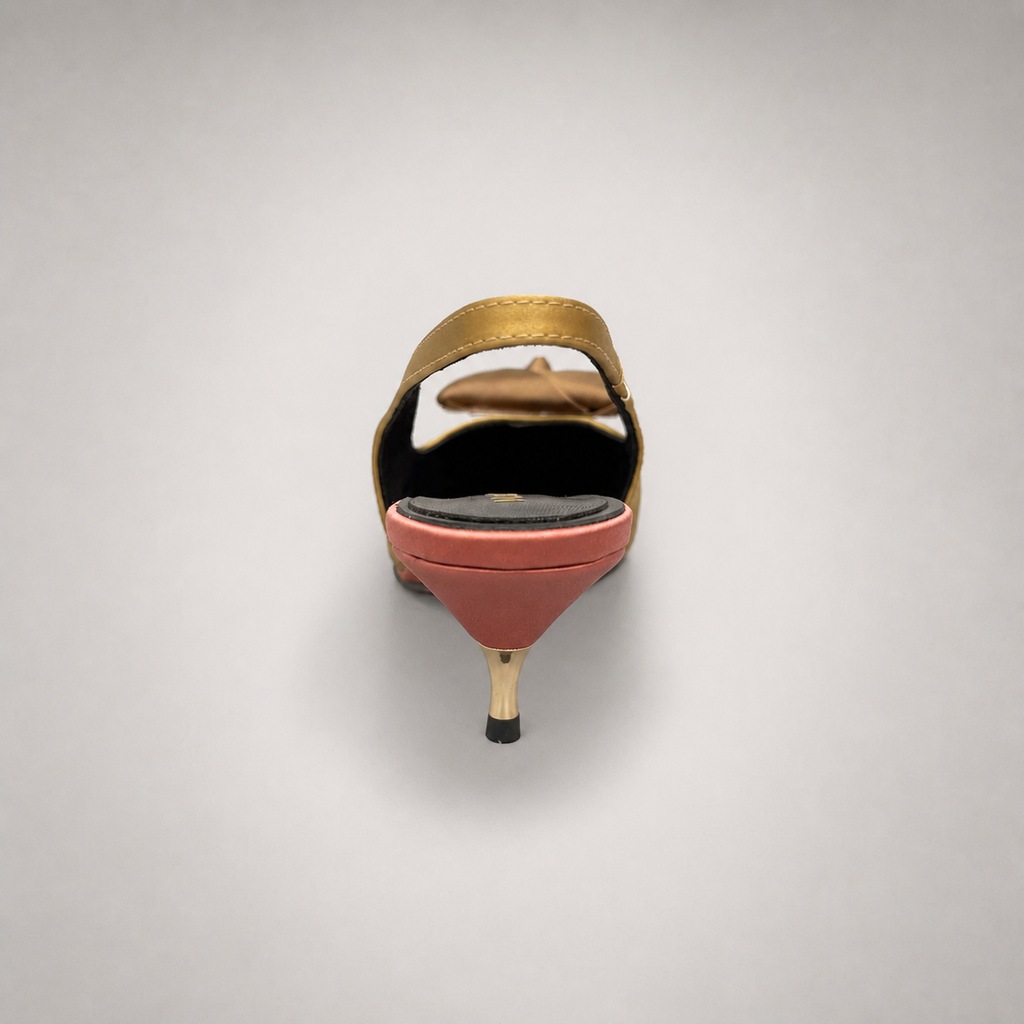 Tan slingback pump rear view showing a pointed toe and bow detail
