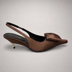 Brown slingback pump side profile showing a pointed toe and bow detail