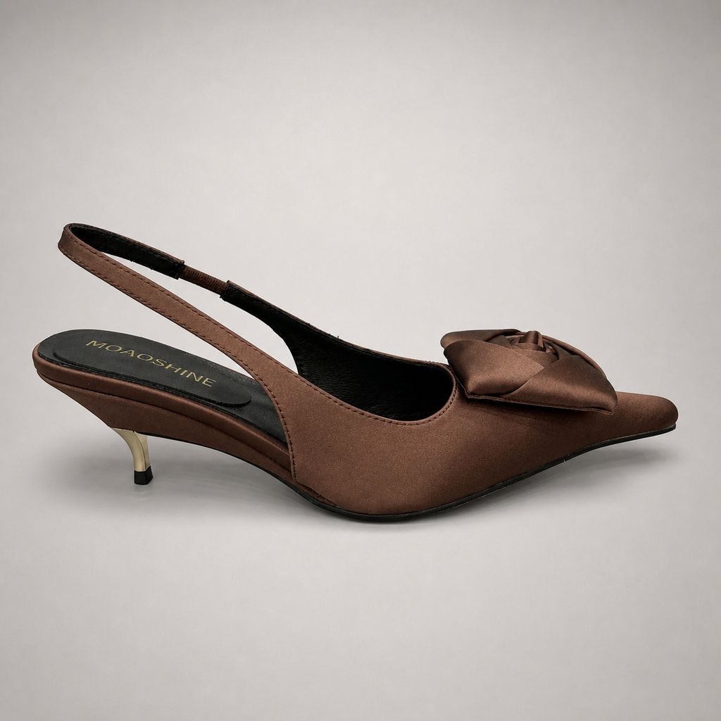 Brown slingback pump side profile showing a pointed toe and bow detail