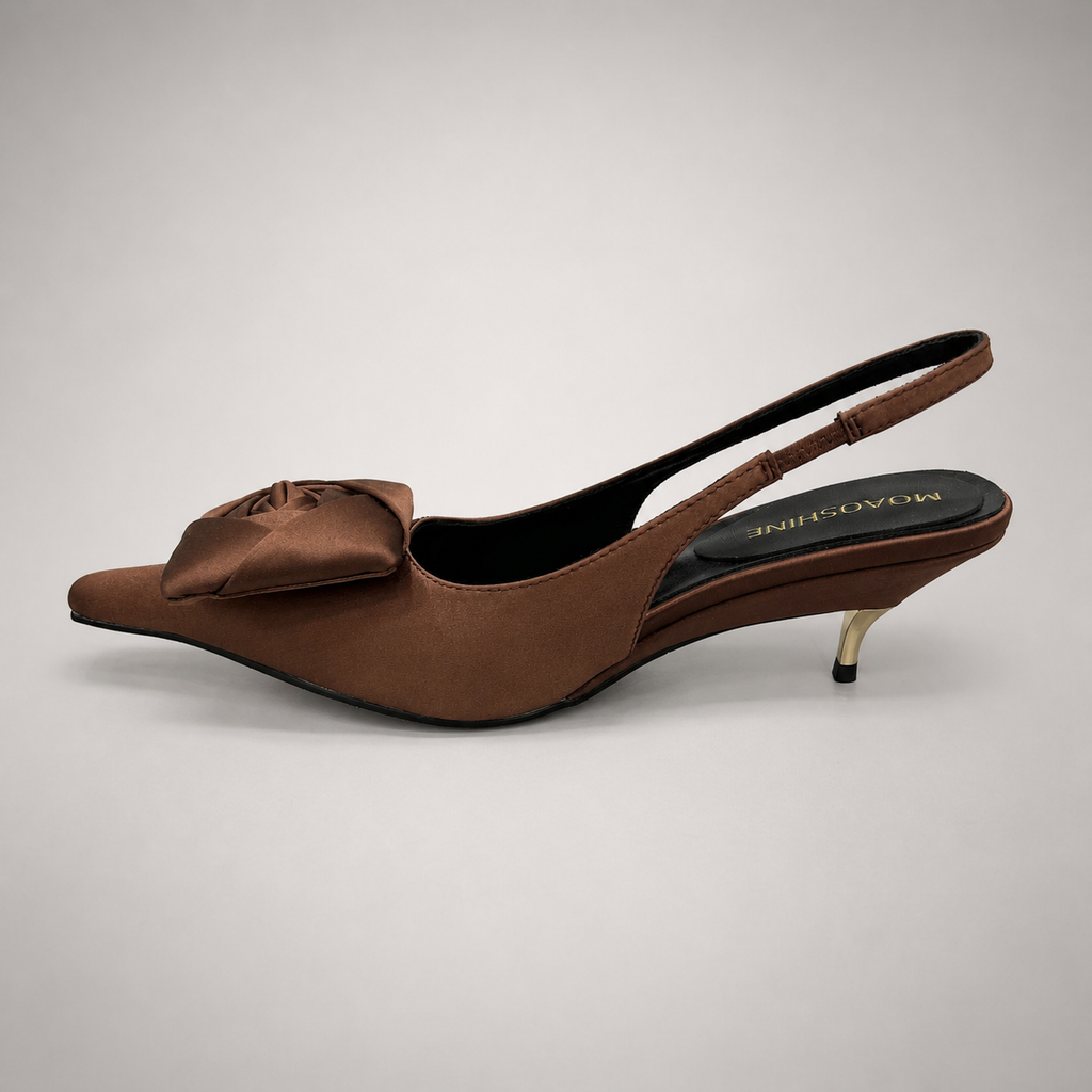 Brown slingback pump opposite side profile showing a pointed toe and bow detail