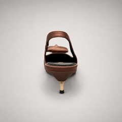 Brown slingback pump rear view showing a pointed toe and bow detail