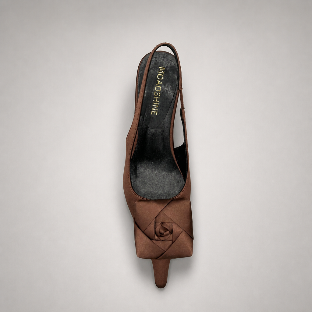 Brown slingback pump outsole view showing the cow leather outsole