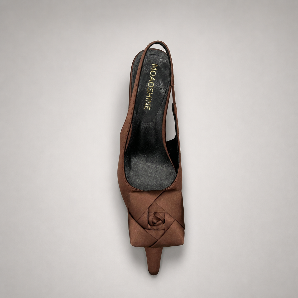 Brown slingback pump outsole view showing the cow leather outsole