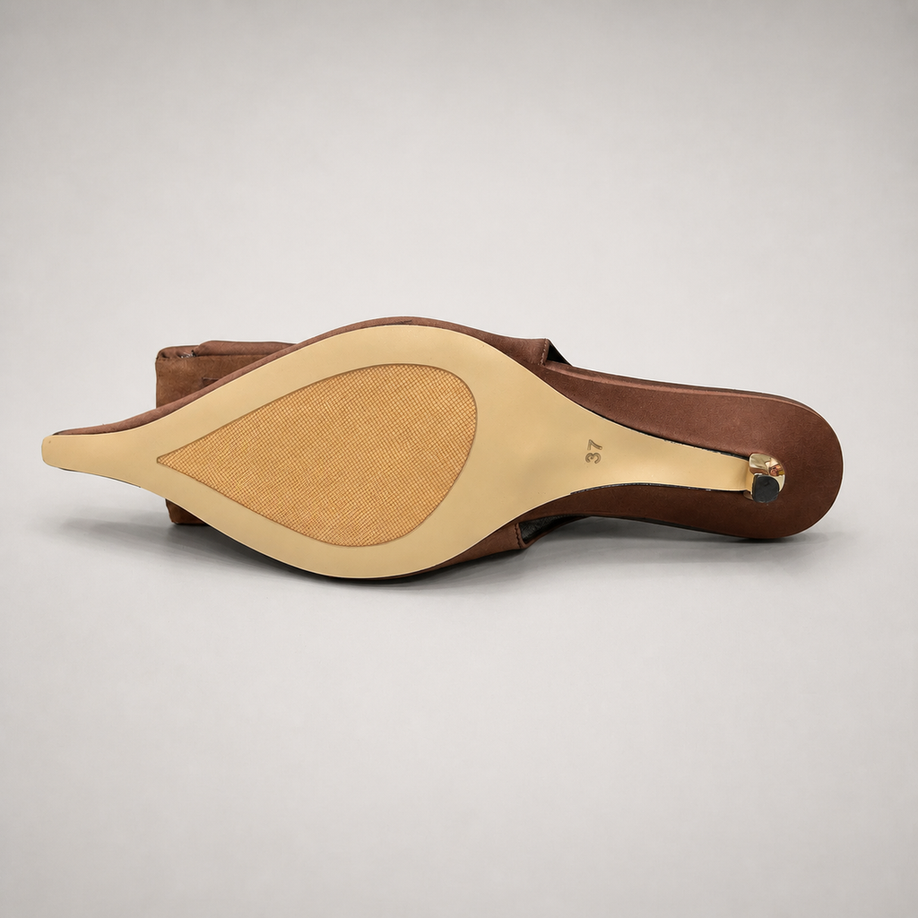 Brown slingback pump top view showing a pointed toe and bow detail