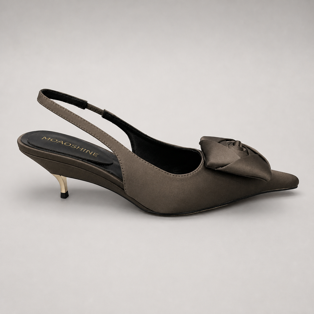 Gray slingback pump side profile showing a pointed toe and bow detail