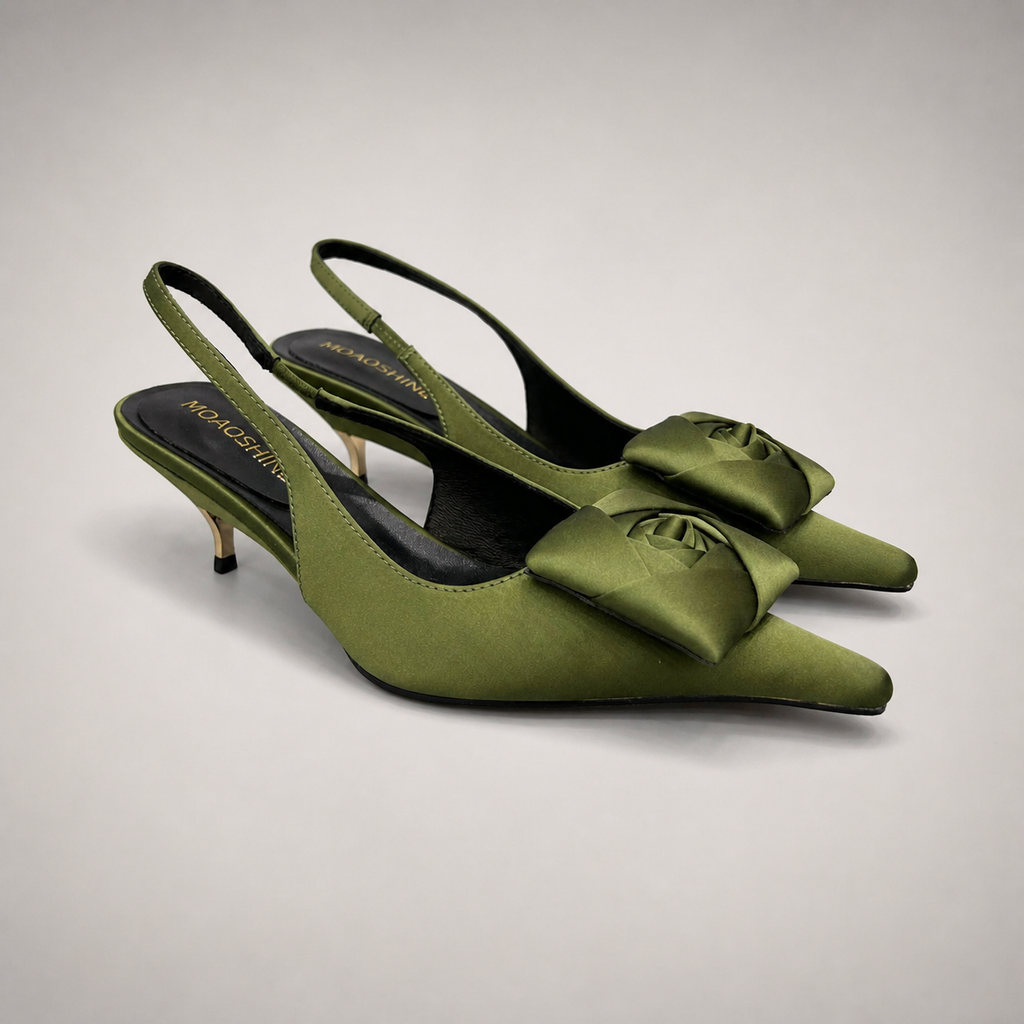 Olive slingback pump pair three-quarter view showing a pointed toe and bow detail