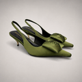Olive slingback pump pair three-quarter view showing a pointed toe and bow detail