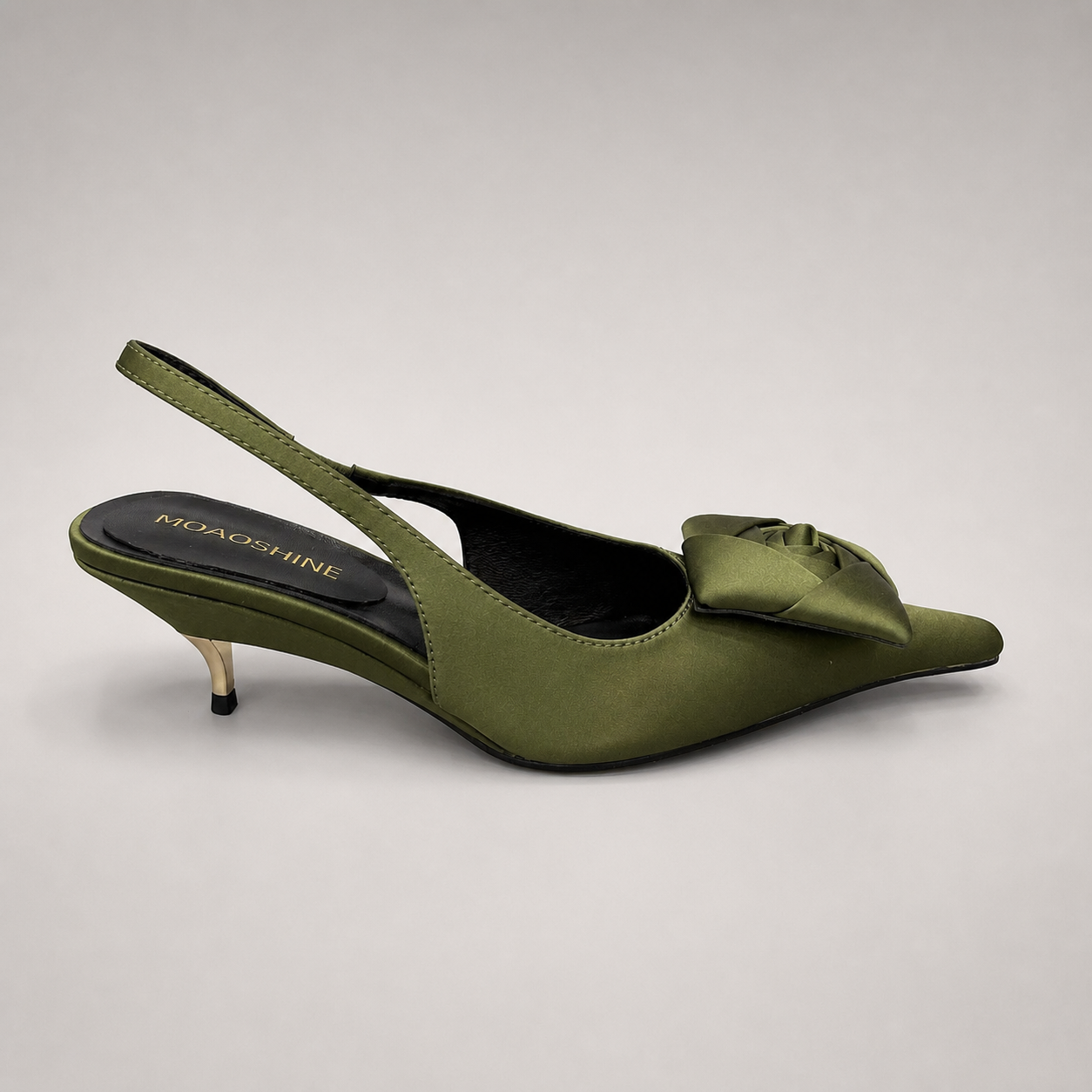 Olive slingback pump side profile showing a pointed toe and bow detail