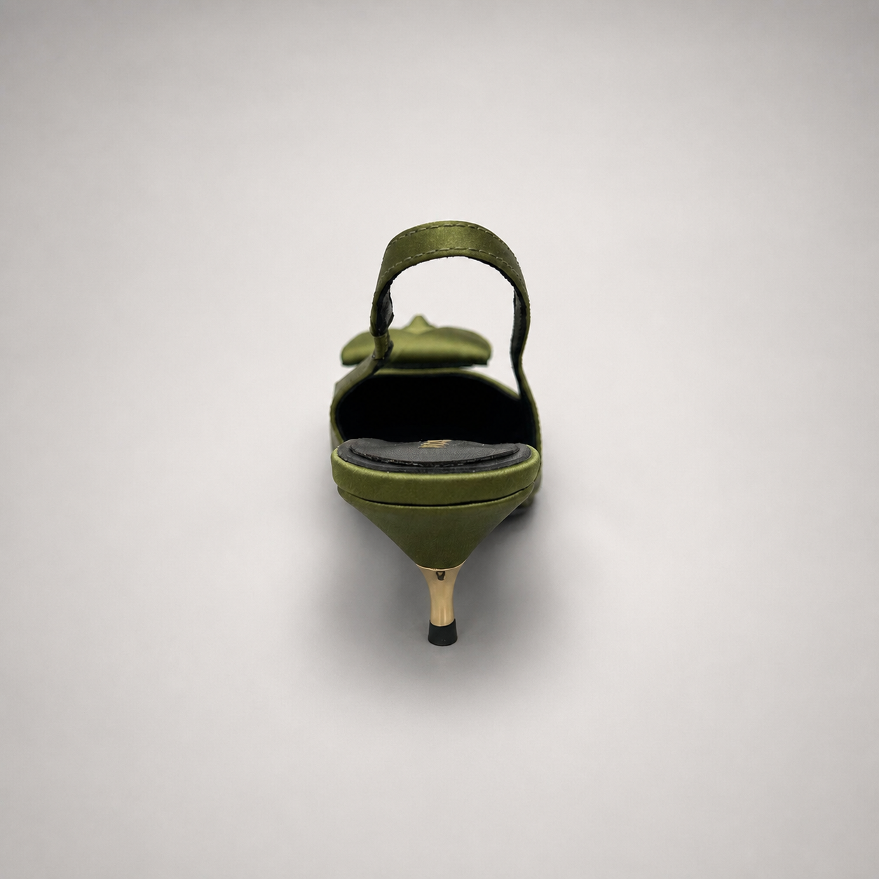 Olive slingback pump rear view showing a pointed toe and bow detail