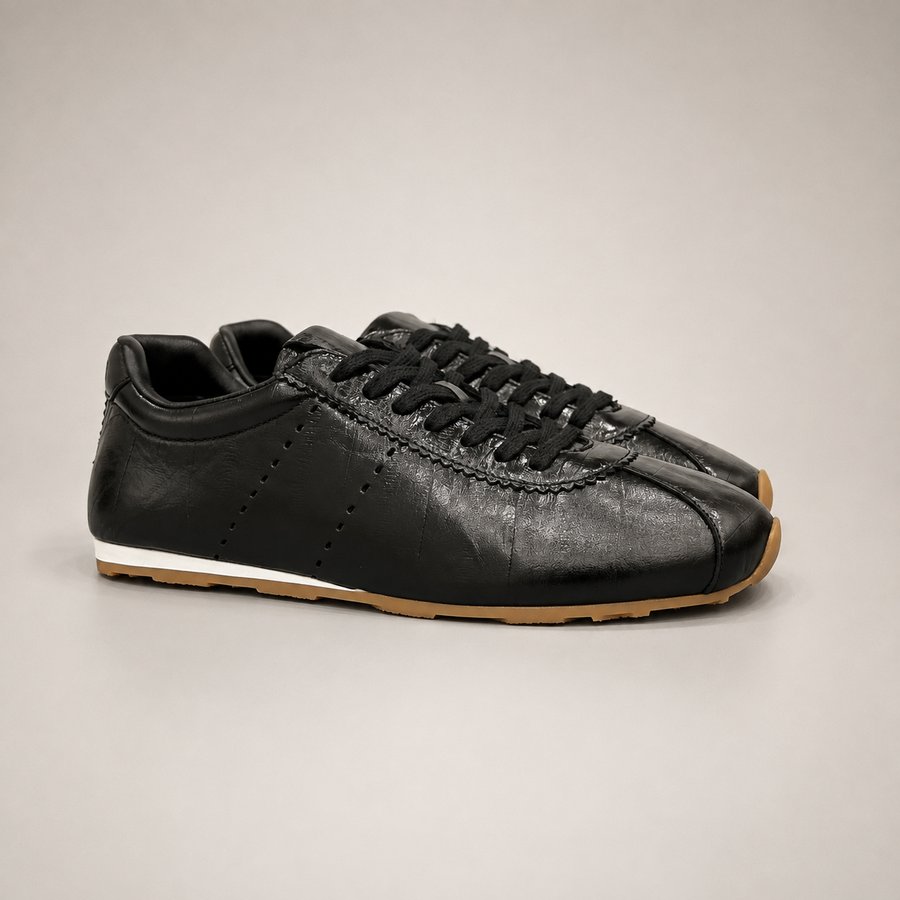 Black Sneakers pair three-quarter view