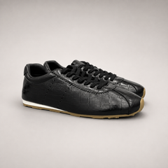 Black Sneakers pair three-quarter view