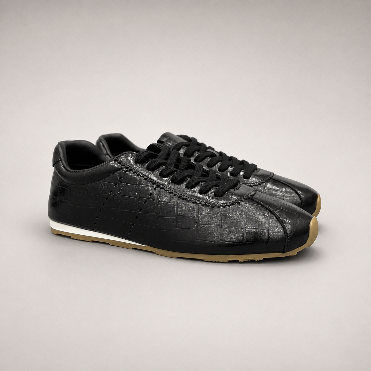 Black Sneakers pair three-quarter view