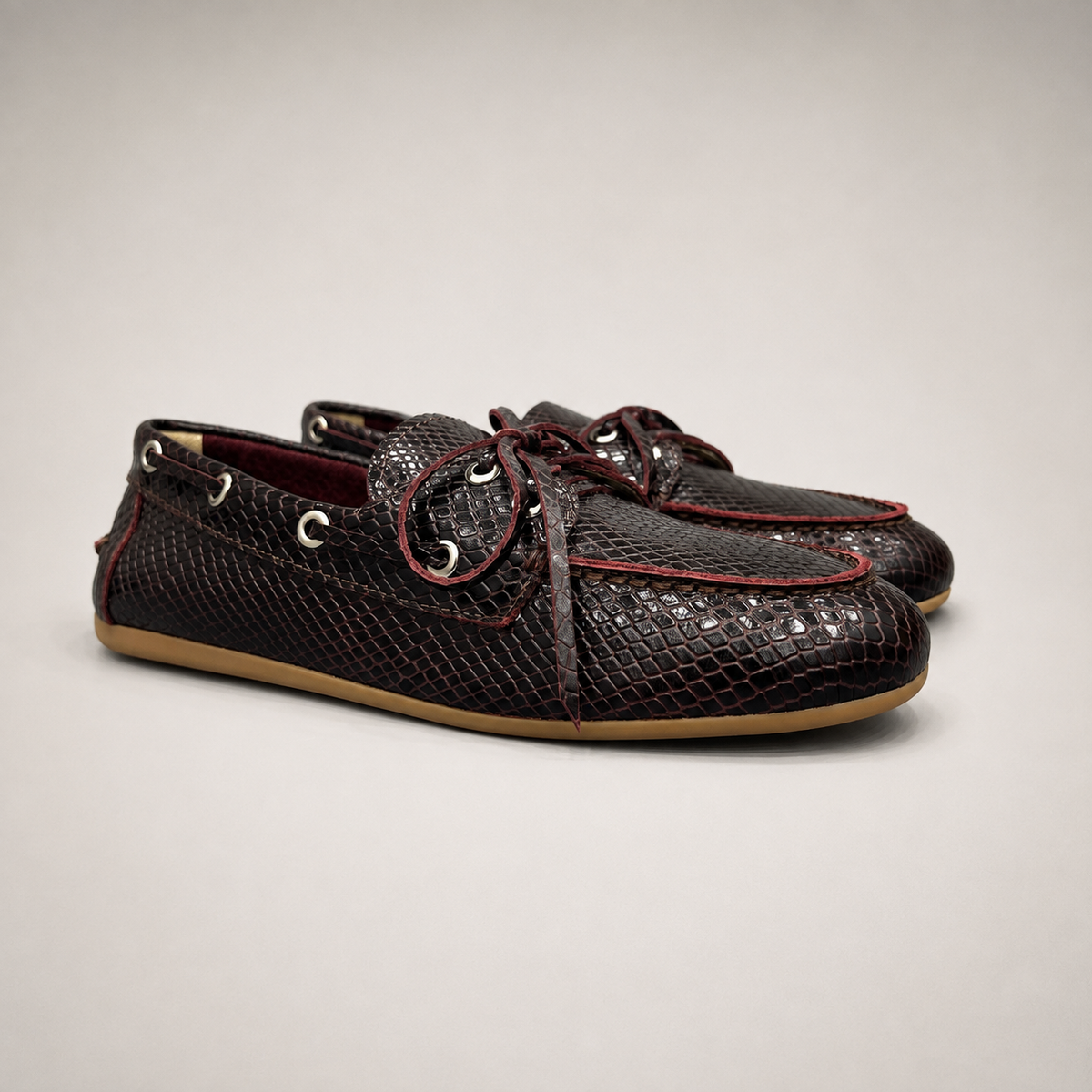 Burgundy boat shoe pair three-quarter view